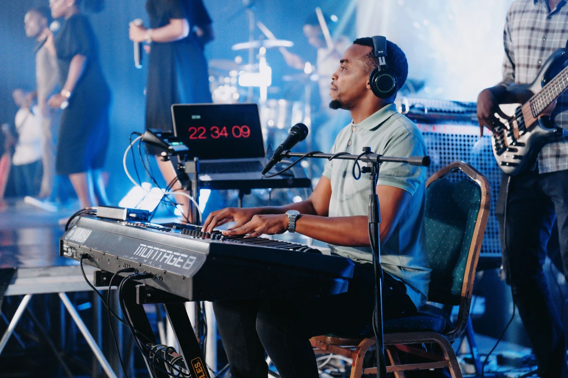 Musician performing on a lit stage