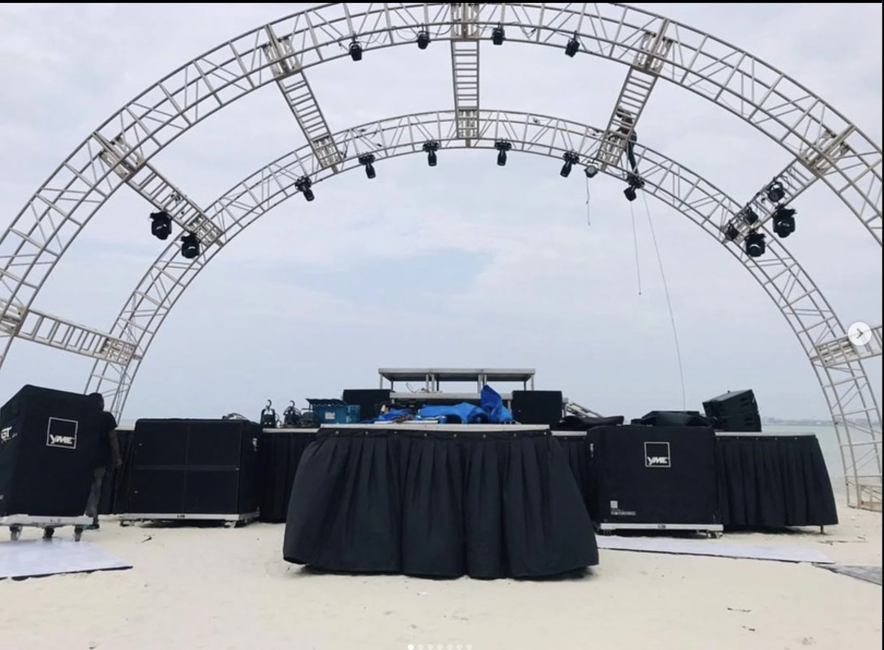 Arched stage truss with lighting and production equipment